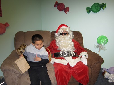 A child sitting with Santa